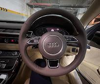 The steering wheel and instrument cluster of an Audi
