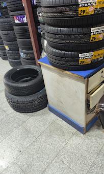 Stacks of tyres on display in the workshop parts store